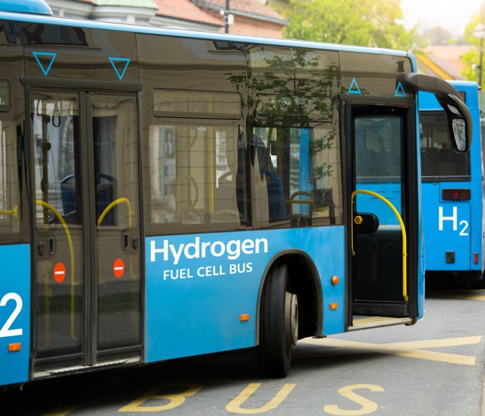 A hydrogen fuel cell buses stands at the station
