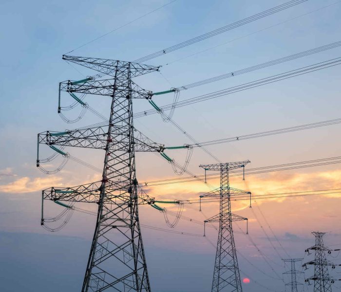 transmission line tower in sunset, steel pylon background