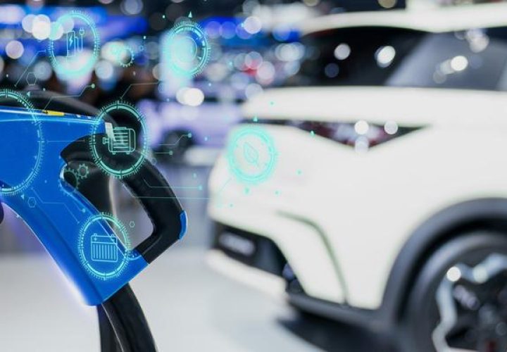 EV A car or electric vehicle at a charging station with a blurry background and a plugged power wire supply. green and sustainable energy idea.